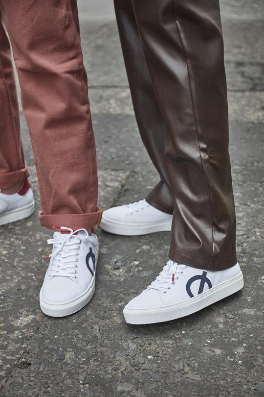 Two Models Wearing LOCI White Vegan Sneakers